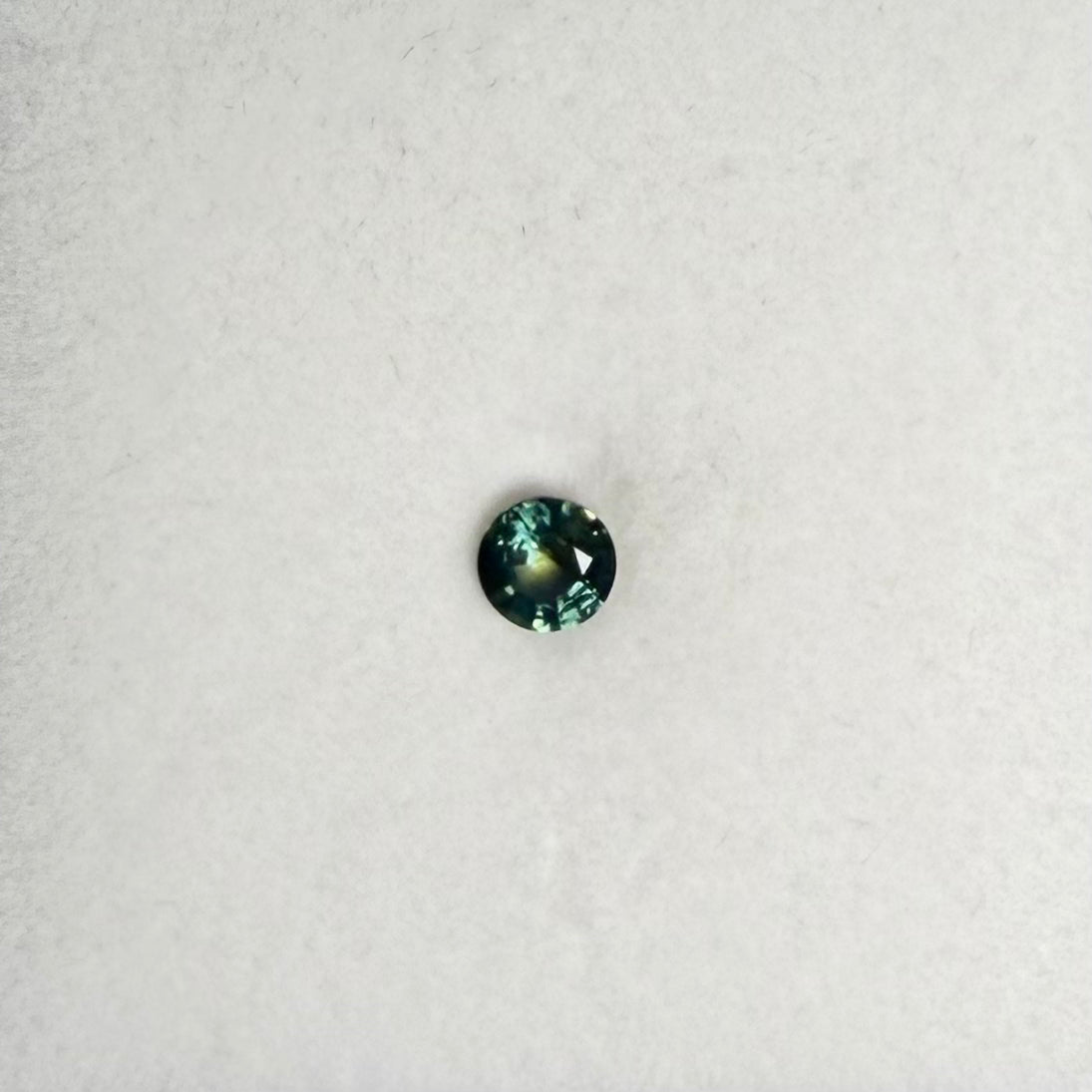 0.61ct Bluish Green Round Sapphire