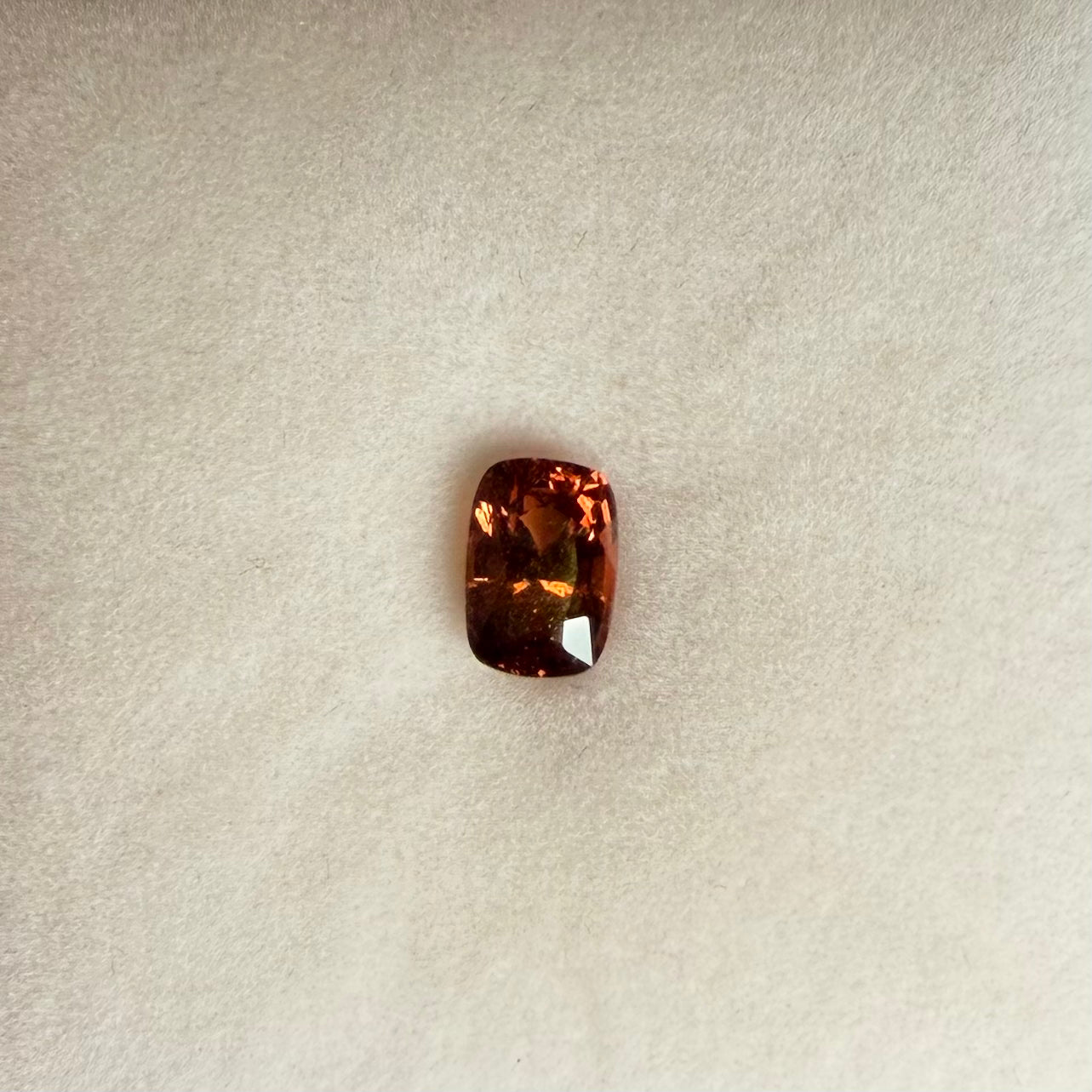 1.42ct Orange Pink Cushion Sapphire